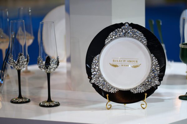 Imperial Classic handpainted luxury wedding set with hand-placed crystals featuring black plate, golden forks, and crystal-embellished champagne flutes