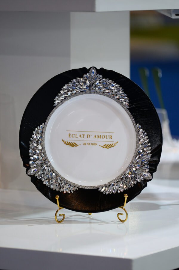 Imperial handpainted luxury wedding plate set with hand-placed crystals featuring elegant black plate with crystal embellishments and golden forks